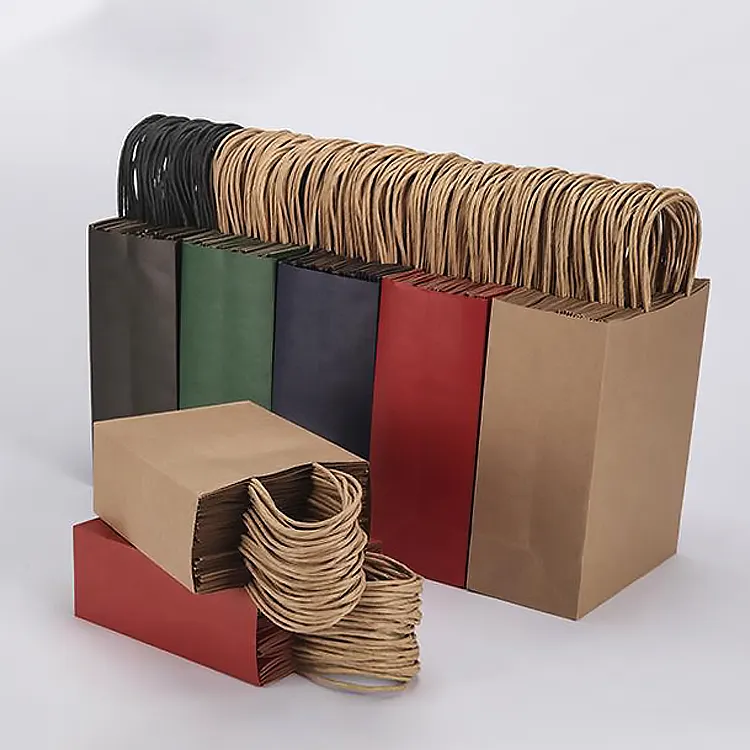 Y30 toptan ucuz lüks ünlü marka alışveriş kağıt hediye çantası özel kahverengi Kraft kağıt hediye çantası Twisted saplı