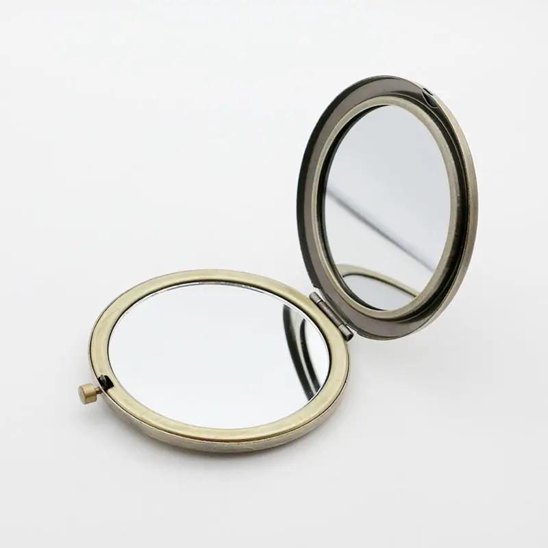 2024 hai mặt biểu tượng tùy chỉnh gương kim loại cầm tay trang điểm cầm tay gương tròn mini pocket gương