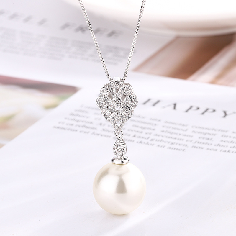 Pendentif perle blanche