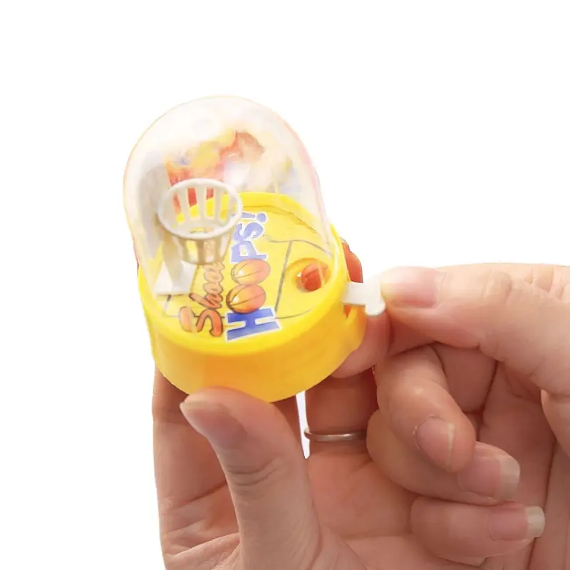 Manufacturers supply handheld mini shooting machine finger basketball hands-on children's catapult educational toys
