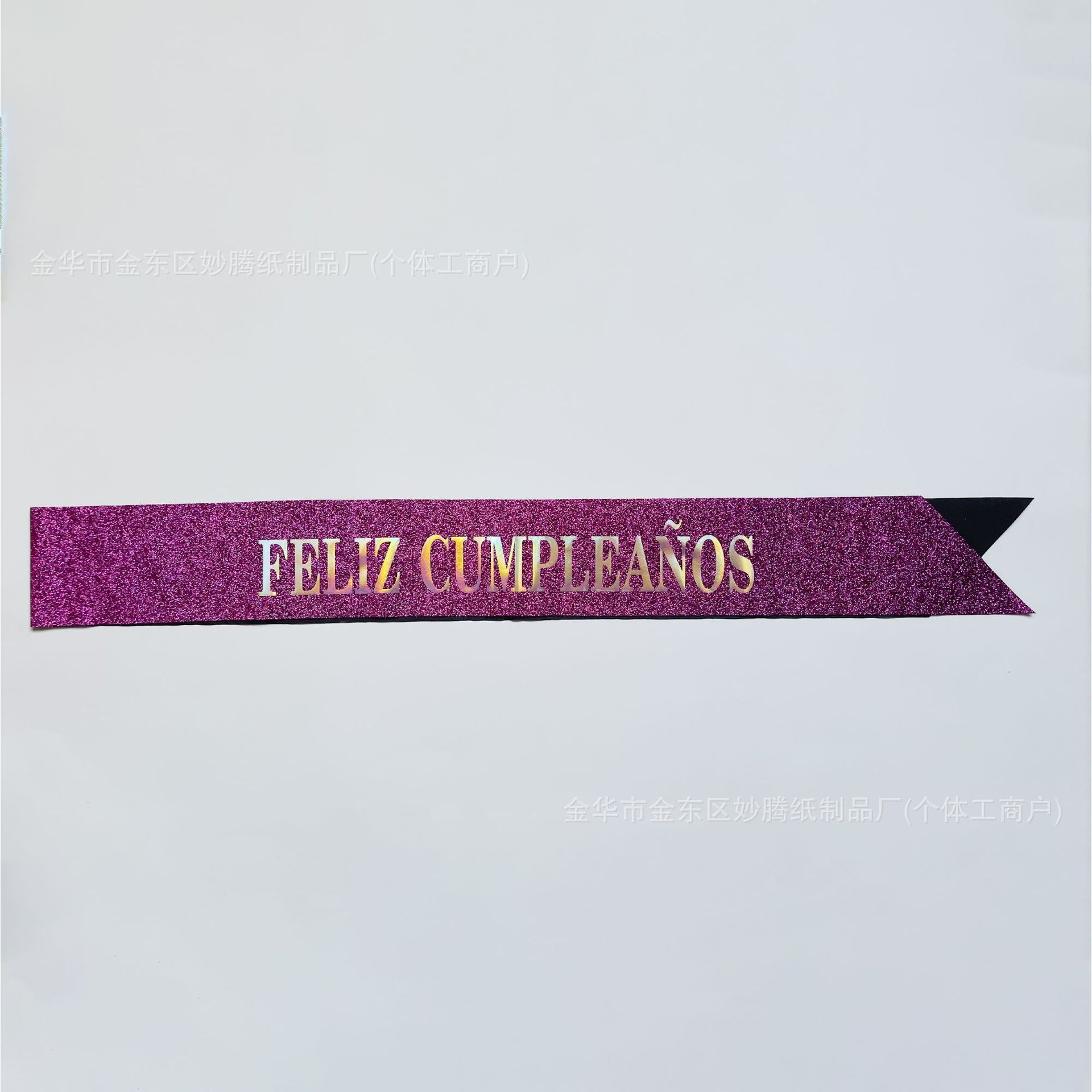 Deep pink fabric with gold powder and silver lettering.