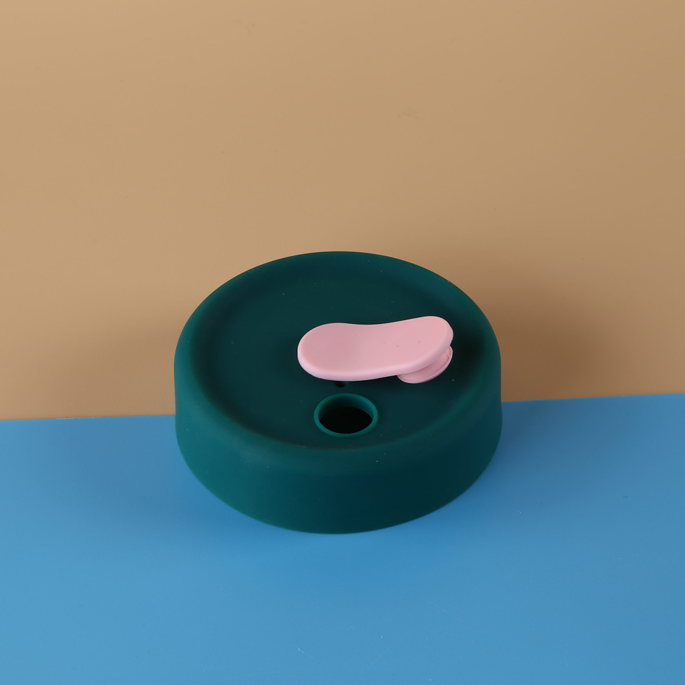 Couvercle vert - bouchon rose