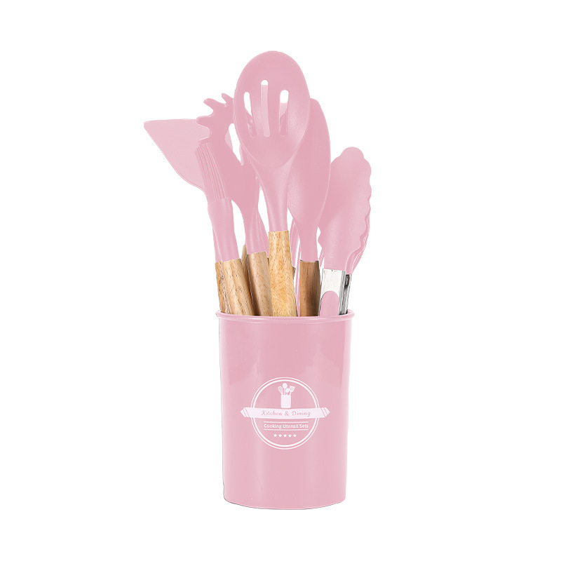 Juego de 12 utensilios de cocina rosa.
