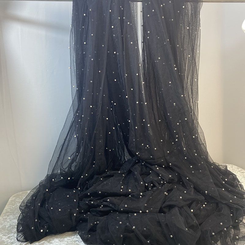 Black yarn highlight white beads