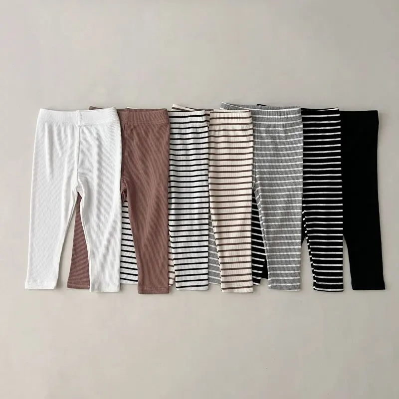 Venta al por mayor de pantalones largos unisex para niños pequeños, mallas a rayas de color sólido, mallas elásticas para niños y niñas