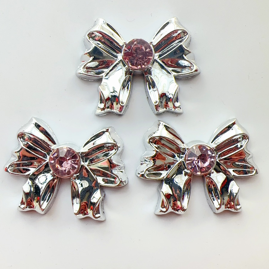 10#: fiocco grande con diamante rosa