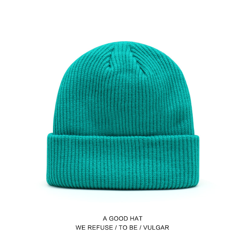 Bonnet en laine bleu paon