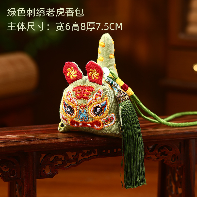 Green embroidered tiger sachet