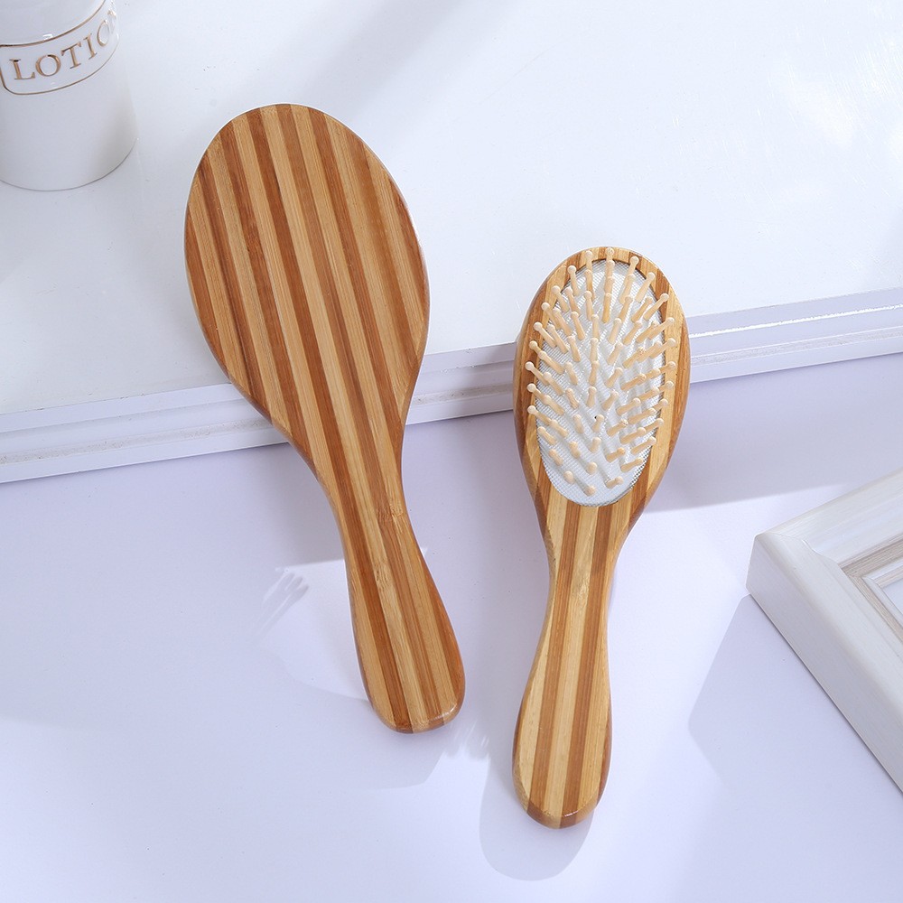 Large oval white leather wooden needle