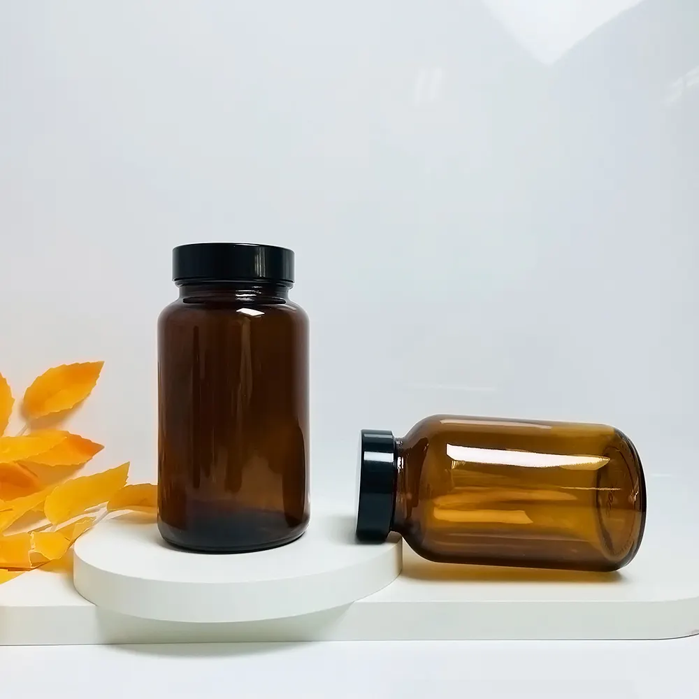 Botellas de pastillas vacías cosméticas de vidrio químico reactivo de medicina esmerilada ámbar personalizadas al por mayor con tapa en espiral esmerilada negra