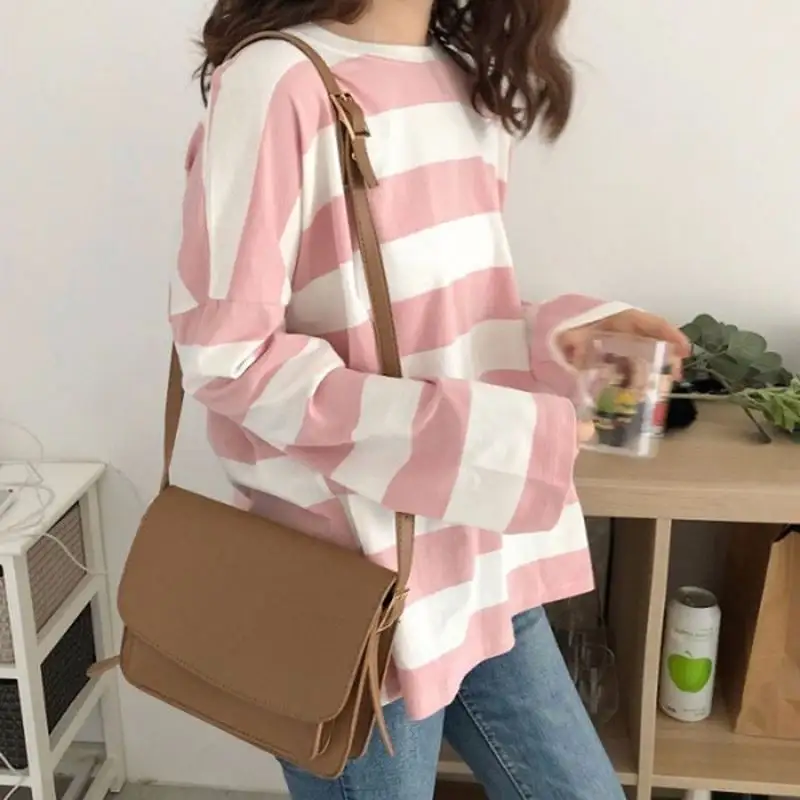 Camiseta de manga larga con cuello redondo para mujer, blusa holgada versátil a rayas, versión coreana, verano 2021