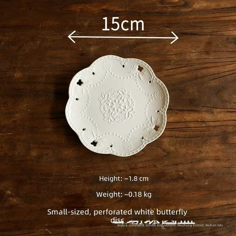 Small perforated white butterfly disc