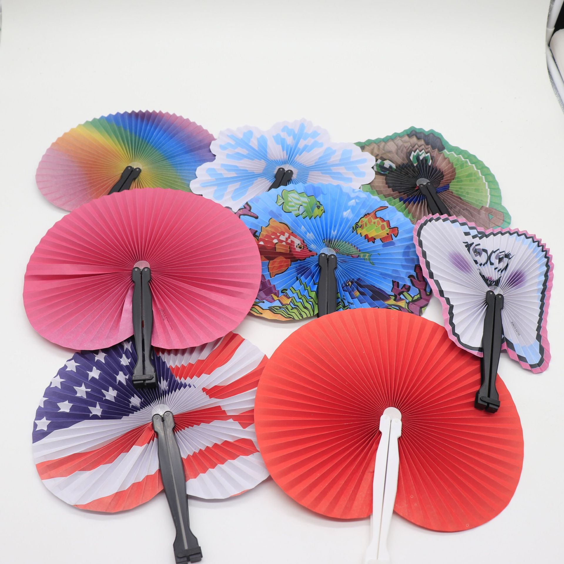 Paper fans are distributed randomly.