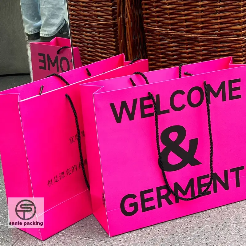 Custom hot pink clothing store shopping gift paper bag