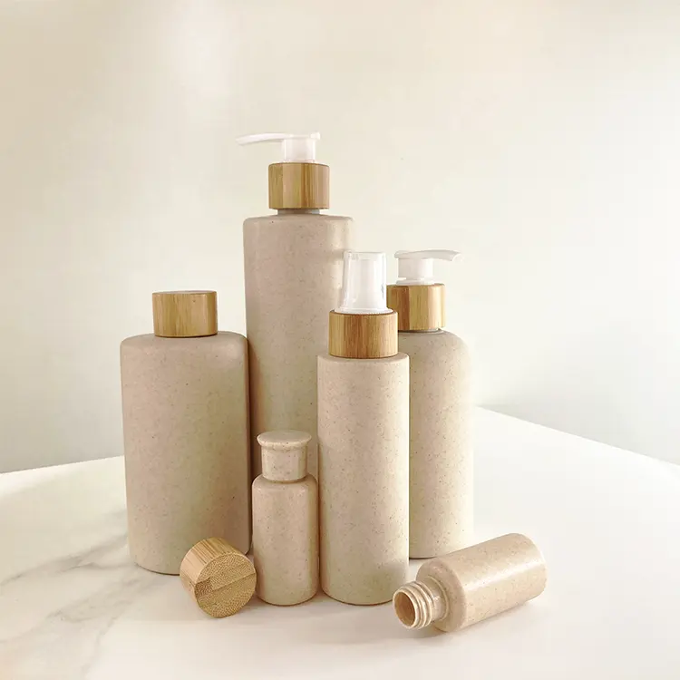 Envase Biodegradable ecológico para cosméticos, botella redonda de plástico Hdpe para champú con tapa de bambú, 300ml, 500ml