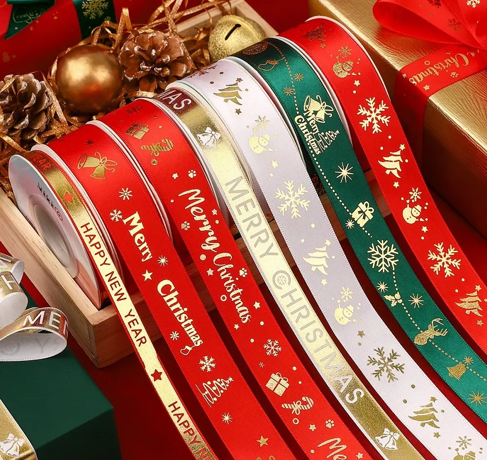 Capodanno tutti i tipi di nastri natalizi con cravatta in oro caldo per la decorazione di torte con fiori regalo