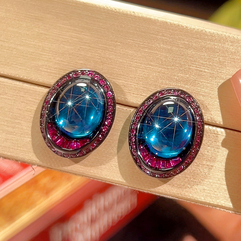 Clous d'oreilles en cristal pointu bleu or noir