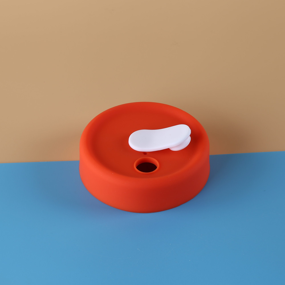 Couvercle orange - bouchon blanc