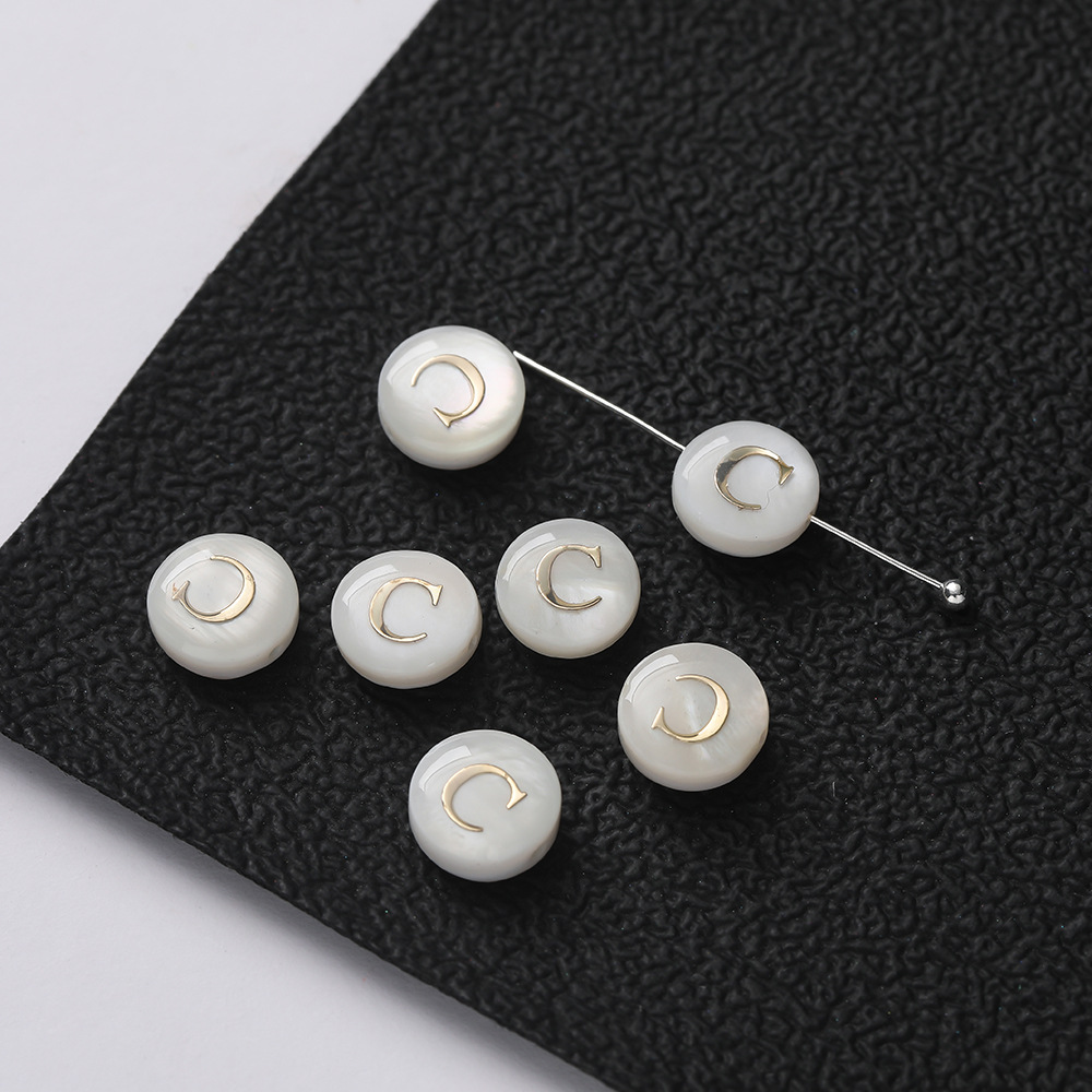 Perles lettres coquillage -- C