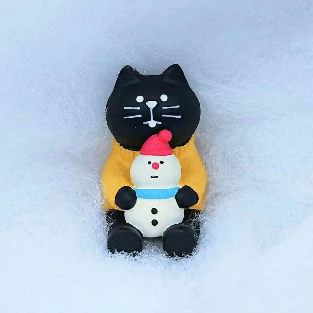 Hug snowman black cat
