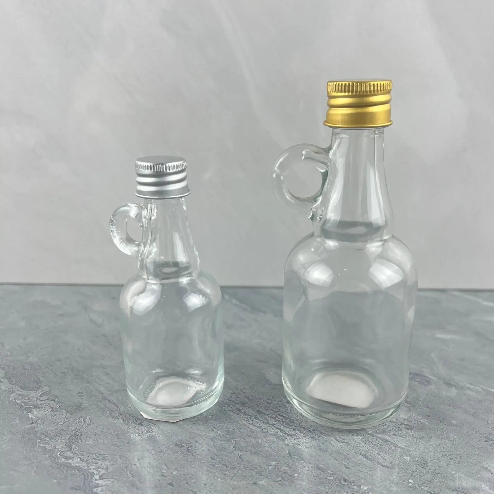 Manufacturer Factory Price Wholesale Clear California Glass Bottle mini liquor bottle with handle 50ml 100ml