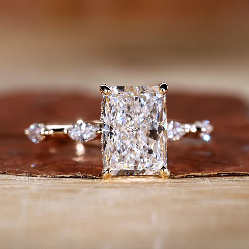 radiant side-stone ring