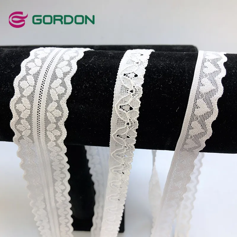 شرائط جوردون بيضاء ممتدة من Gordon مع نمط أزهار لتزيين حفلات الزفاف والخياطة وصناعة الحرف اليدوية التي تصنعها بنفسك