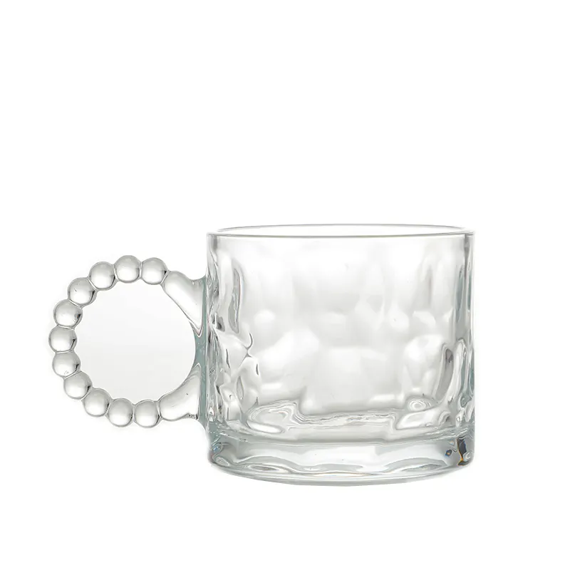 Taza de vidrio para bebidas en relieve de 300ml de nuevo diseño con vidrio con mango perlado