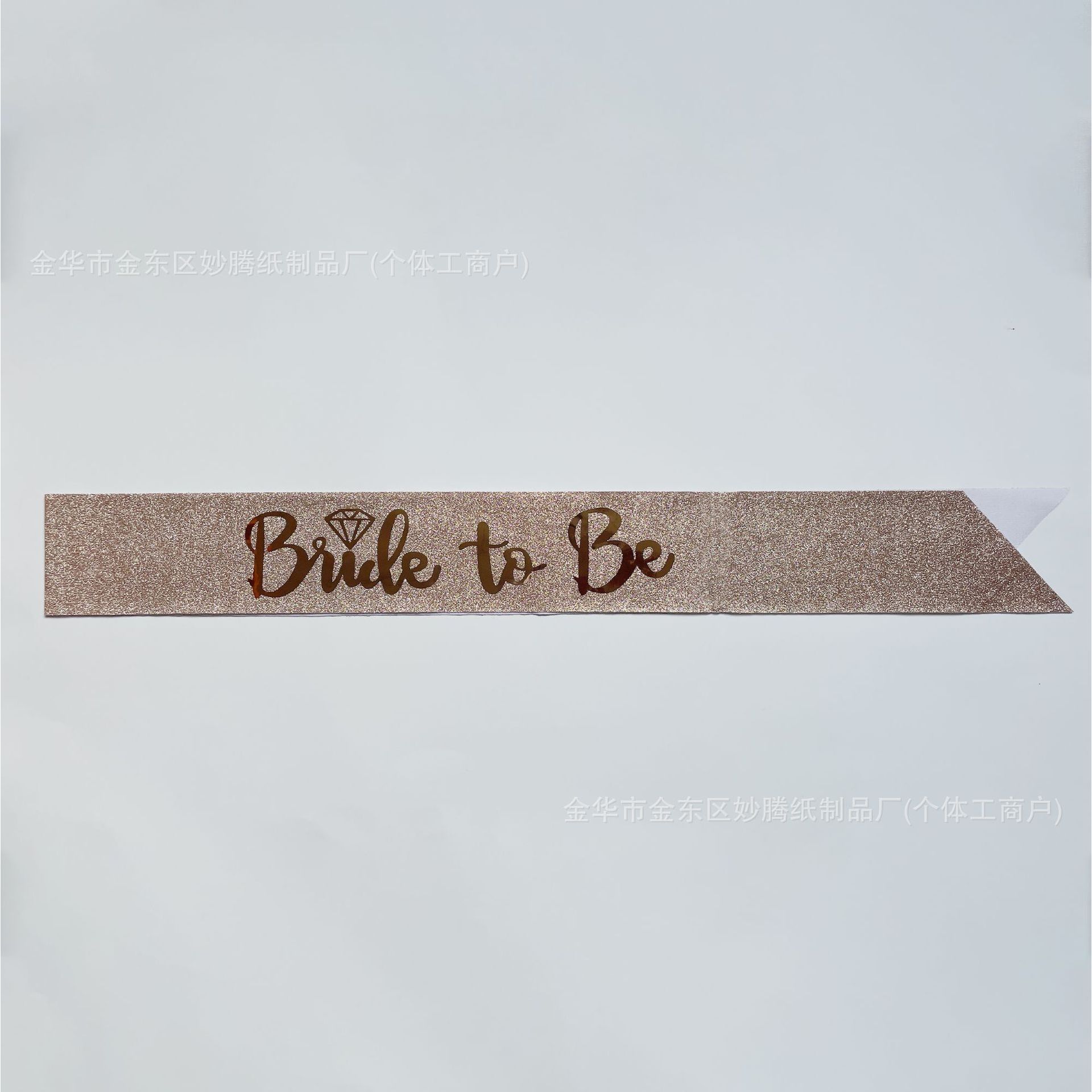 Light pink glitter fabric with gold lettering and hot stamping