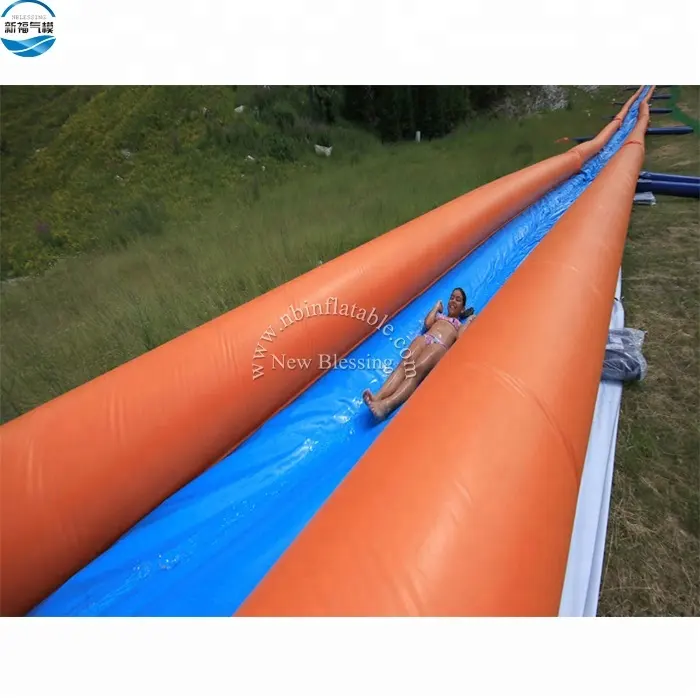 Le plus long toboggan aquatique gonflable du monde à vendre 1000 ft slip n slide toboggan gonflable le prix d'usine de la ville