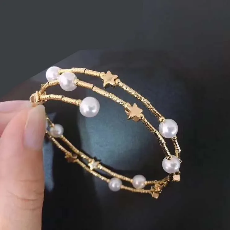 Hot-vendita di nuovo modo di fantasia stella grafici a doppio strato elastico 14 K oro braccialetto della perla