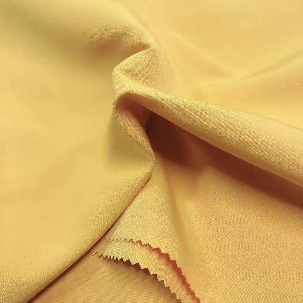 Tissu 100% polyester microfibre résistant au vent pour veste, peau de pêche pour enfants