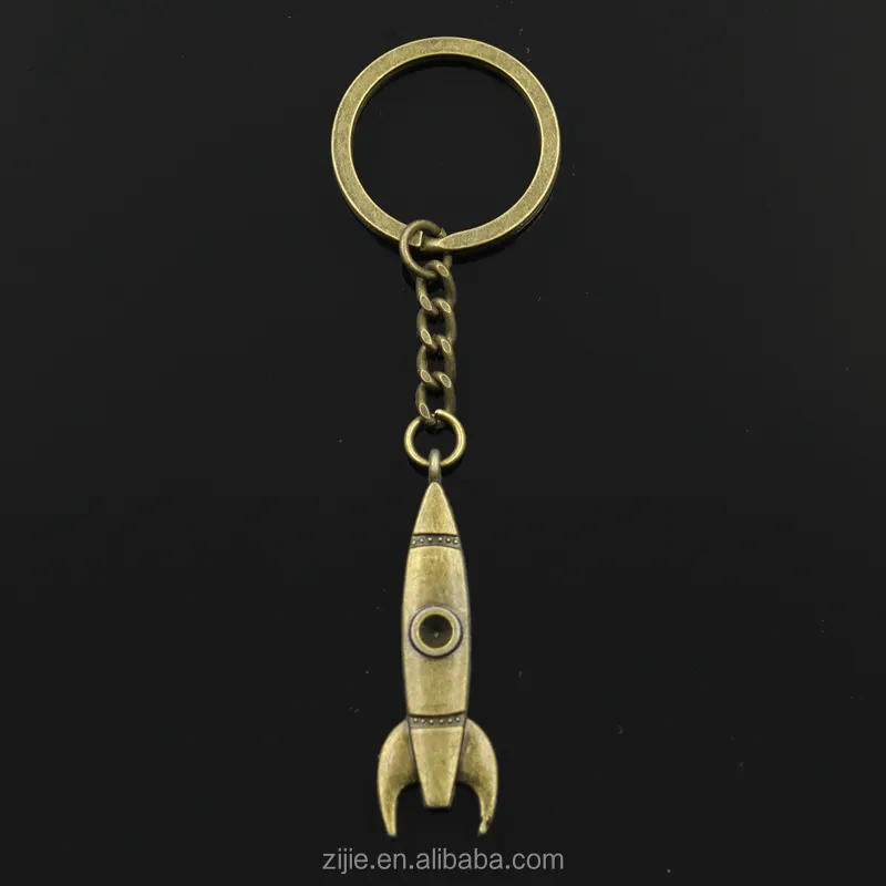 Yiwu wholesale custom charms keychain/vintage zinc alloy rocket shape key holder bronze keychain