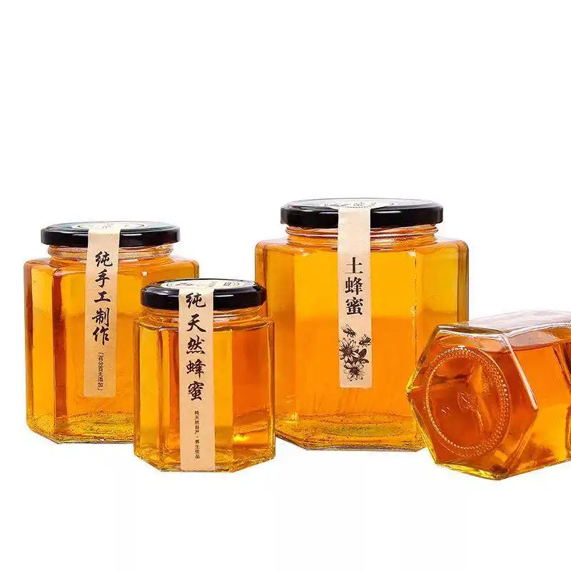 Hoge Kwaliteit Aangepaste Hexagon Vorm Glazen Pot Voor Honing Jam Voedsel Opslag Met Deksel