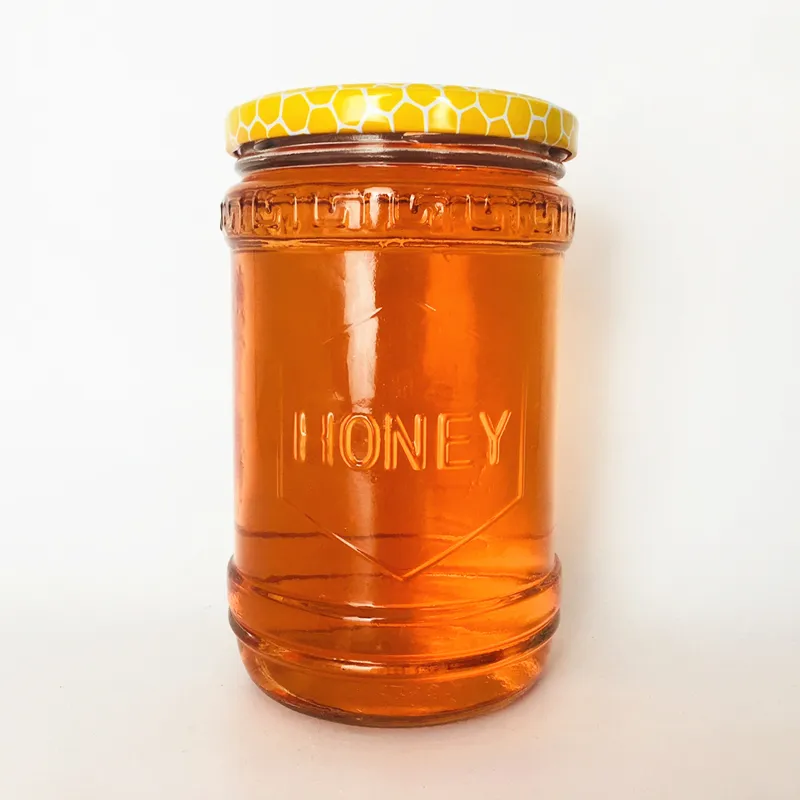 Vaso di vetro trasparente vuoto da 600ml all'ingrosso forma unica conservazione del miele con coperchio logo design