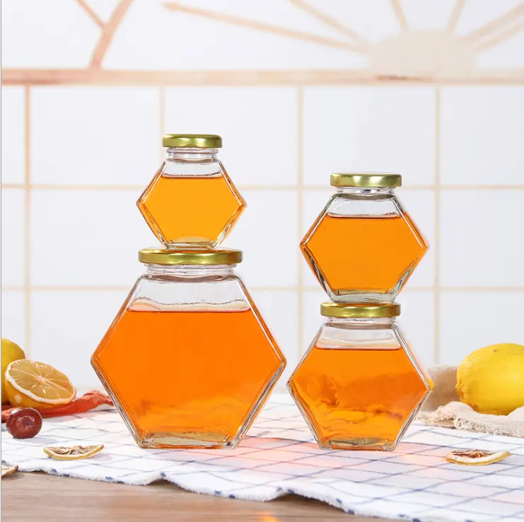 Fancy Disegno 250ml 250g di vetro esagonale miele bottiglia di vaso con coperchio dorato, 250g miele esagonale vaso di vetro sigillato con coperchio in metallo