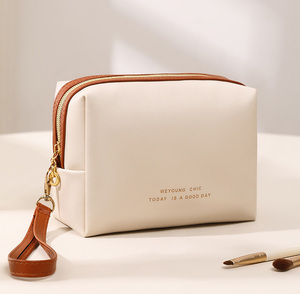 <strong>2025</strong> New Arrival Customized Logo Cream Luxury PU Leather Makeup Bag Large Fashion Portable Zipper Beauty Cosmetic <strong>Pouches</strong> - Product Image 1