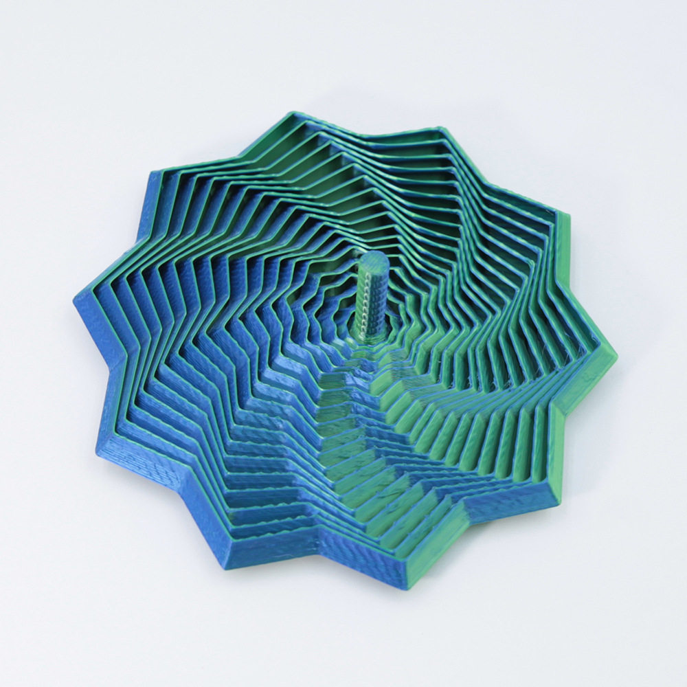 Étoile spirale bleu-vert 12 cm