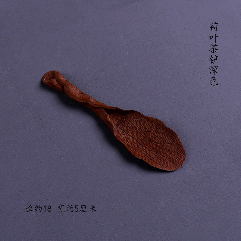 One dark-colored lotus leaf shovel