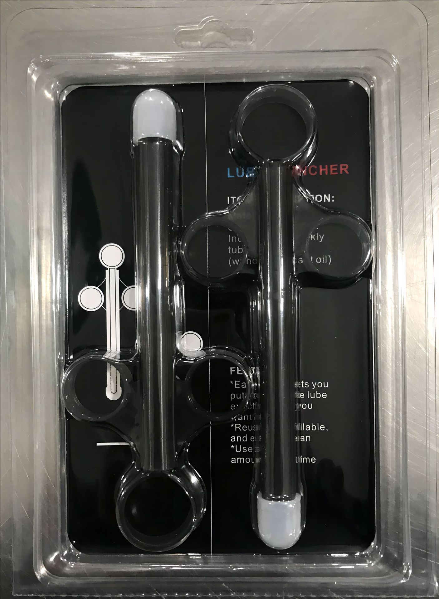 Jeringa lubricante translúcida negra en blister de dos unidades