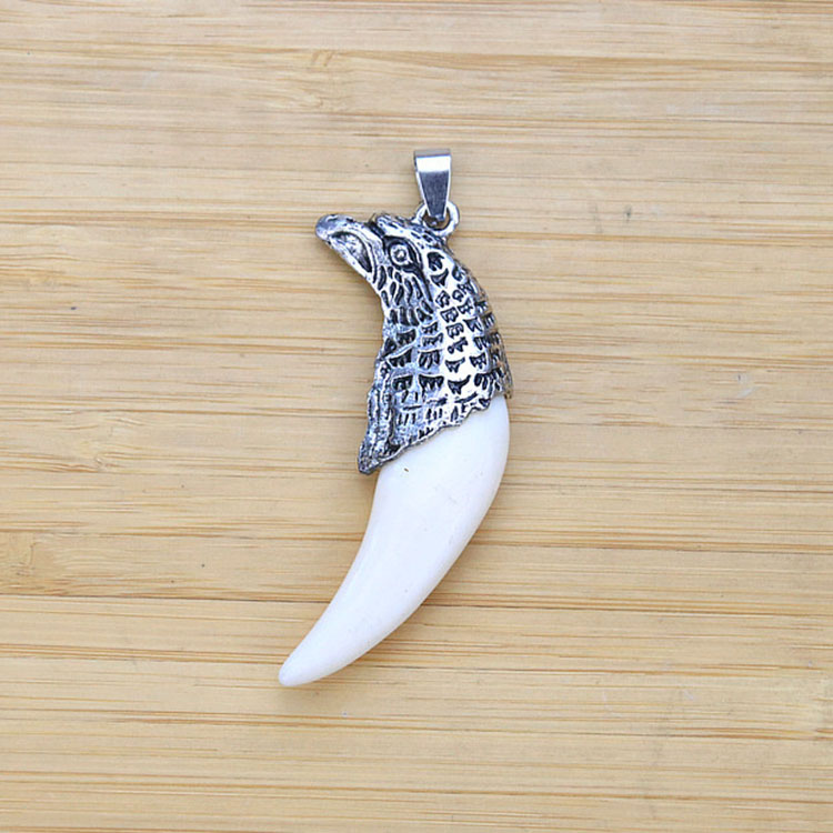 antique silver goshawk head