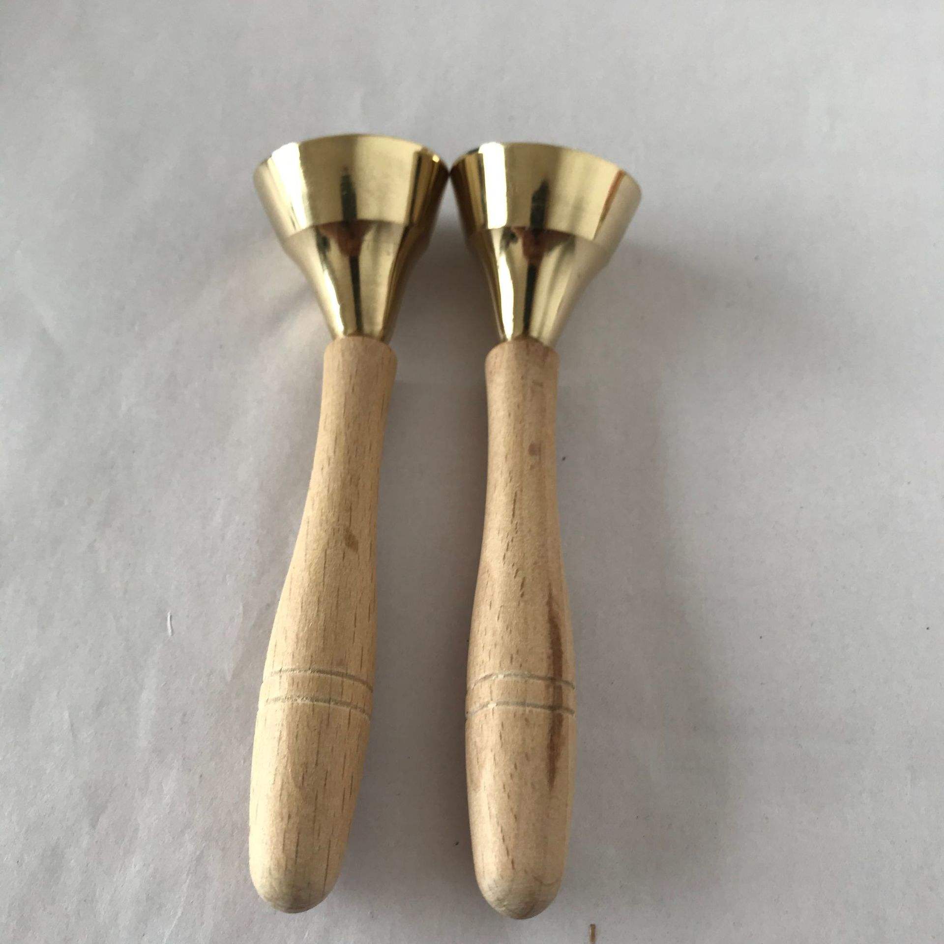 Small copper chime with wooden handle