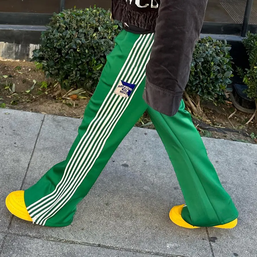 Pantaloni a gamba larga Unisex personalizzati pantaloni da donna con fettuccia laterale svasata impilati verdi pantaloni da passeggio da uomo di marca di alta qualità