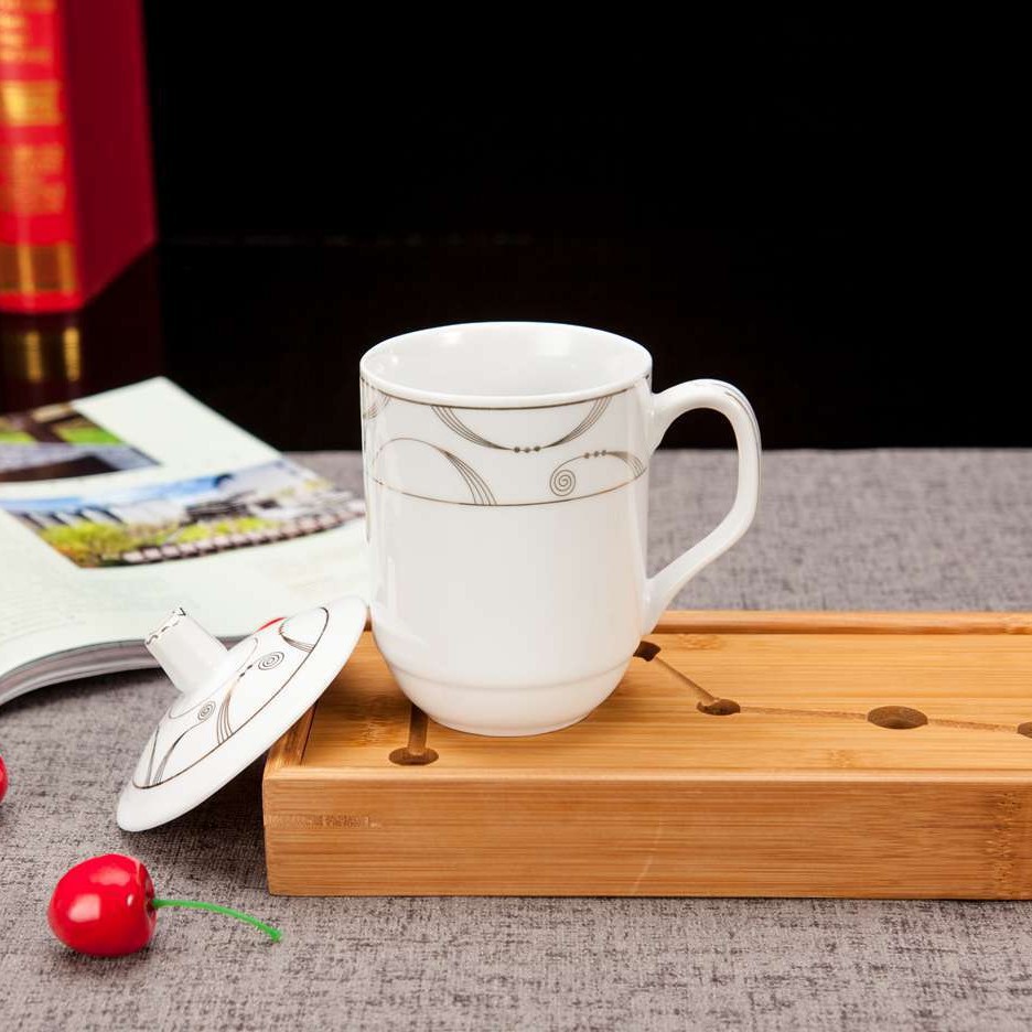 White cup & gold pattern