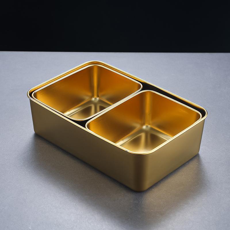 Gold-colored set of serving platters