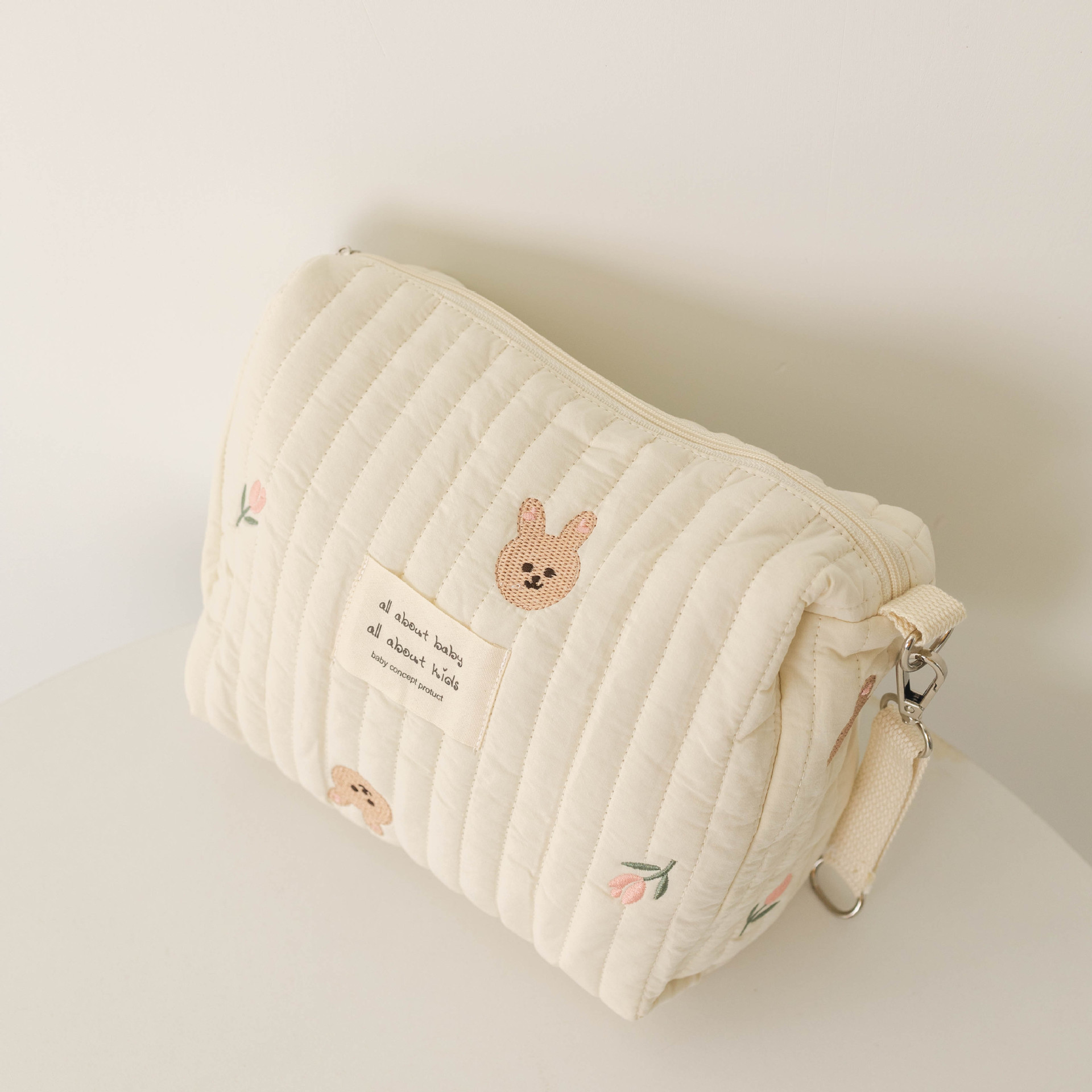 Sac momie à bouton unique tulipe lapin blanc