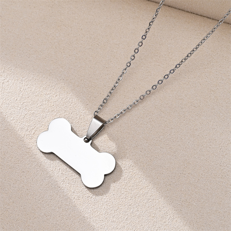 Pendentif chaîne 04X50, os de chien 1,5X3,0, couleur acier.