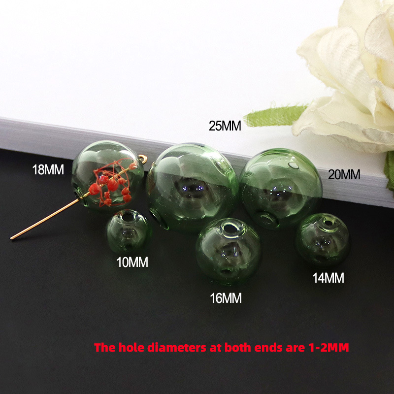 Boule de verre verte à double trou