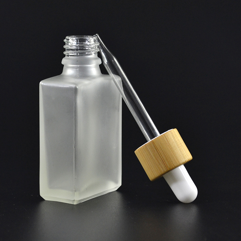 Fosted clear bottle with bamboo dropper