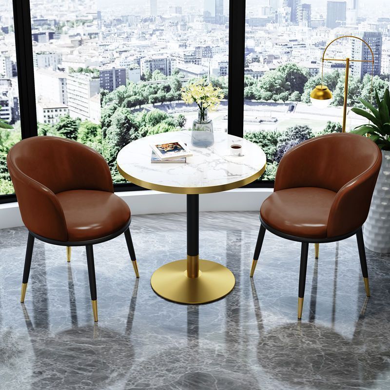 Brown leather chair imitation stone round table
